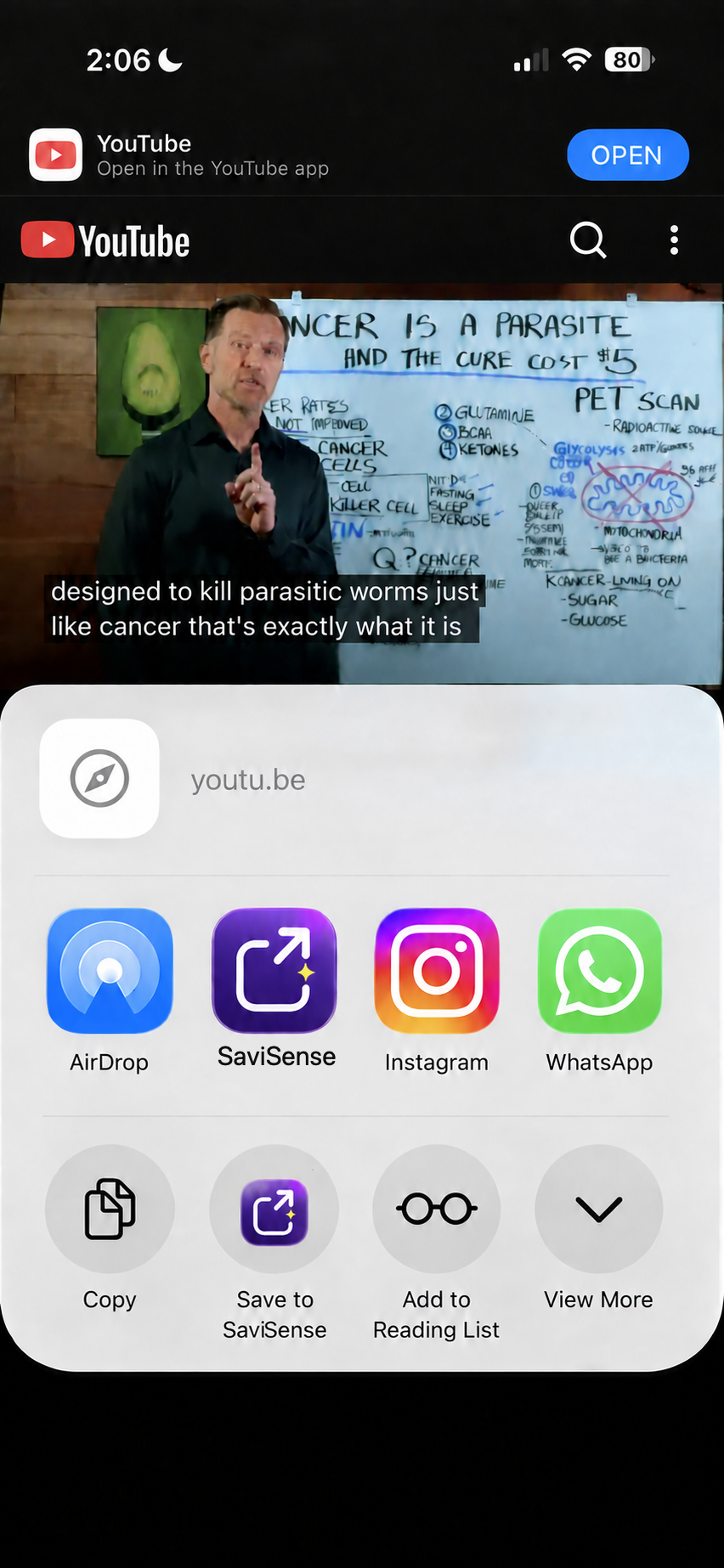 YouTube video about a parasite claim open in the iPhone Share Sheet with SaviSense ready to tap; contact suggestions are removed